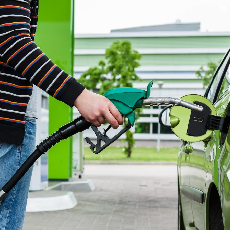 Green car on a gas station